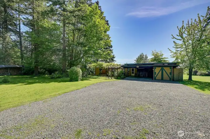 The approach to the house has ample parking space.