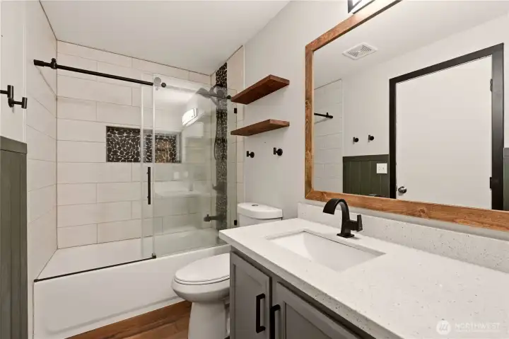 Beautifully updated Bathroom, quartz and tile
