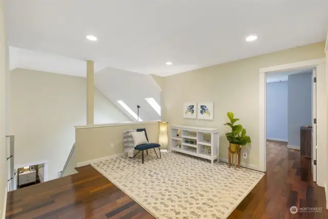 Upper level offers a loft style family room, 2 additional bedrooms, and a full bath.