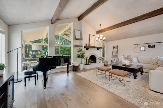 The perfect spot for heartfelt conversations, or even a melody or two! Living room has beautiful, vaulted ceilings with views of the backyard and golf course.