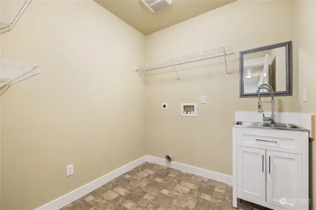Laundry with utility sink & upgraded cabinetry