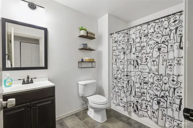 Hall bath with lovely tile flooring