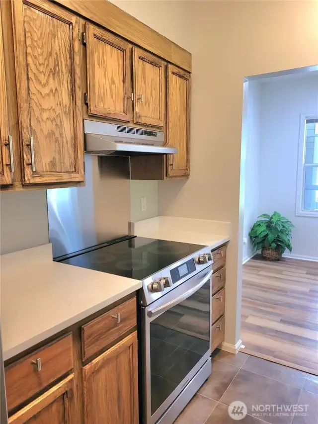 Kitchen with granite countertops and new stainless appliances