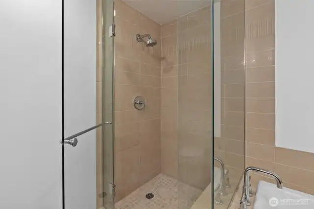 Separate enclosed shower.