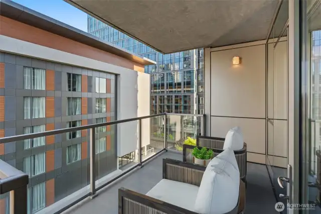 Large balcony accessible from living area and bedroom.