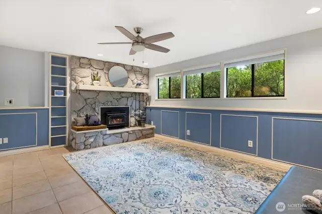 Comforting wood stove, wainscoted walls.