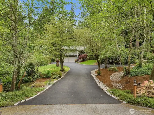 Beautiful, long manicured entry.