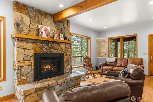 Hand-laid stone fireplace, wood beam accents, and wood floors, views... views....