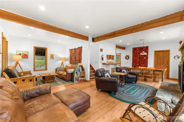 Spacious great room with warm wood tones, cozy seating, and rustic accents—perfect for relaxing after a day on the trail
