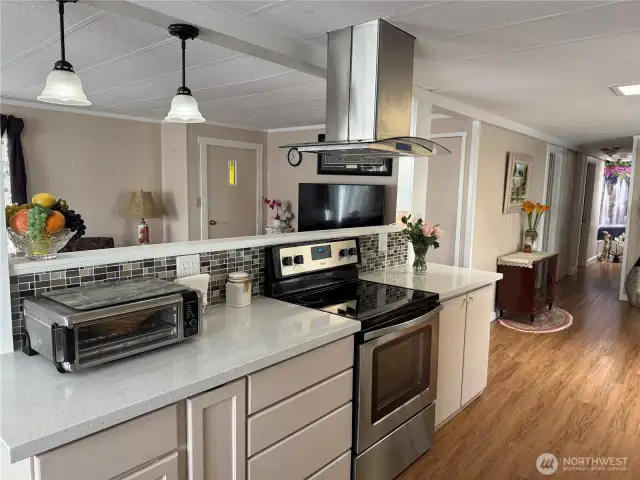 New laminate flooring, professional vent, quartz counters, newer appliances