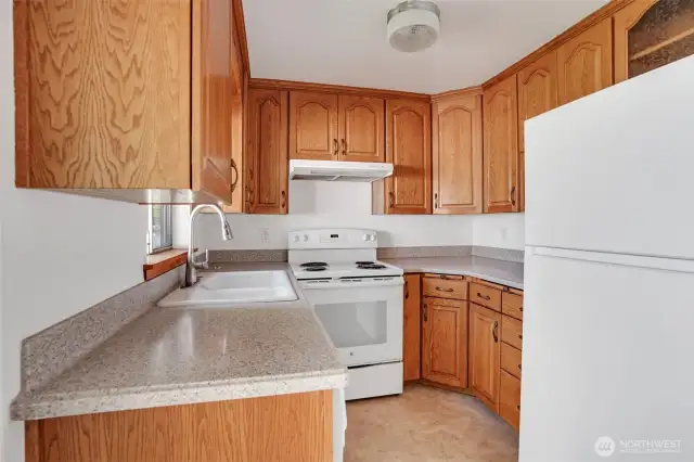 A dainty kitchen has everything you need at your fingertips.