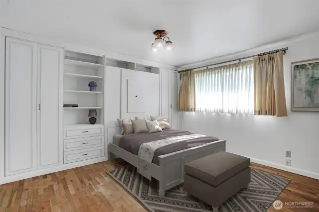Timeless built-in wall unit adds more personal storage without giving up space and houses a murphy bed.