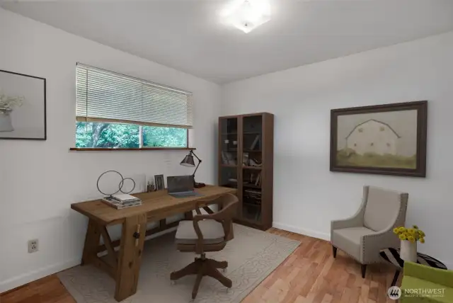 One of two bedrooms both with hardwood floors. This one is virtually staged as an office.