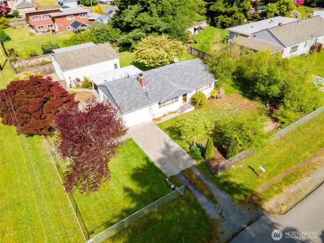 This corner lot enjoys extra privacy with a bit more yard space than typical interior lots.