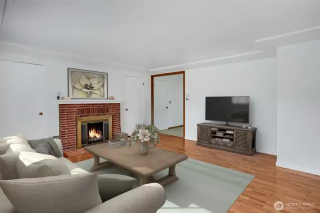 Upon entering the home, you are greeted by beautifully refinished hardwood floors.