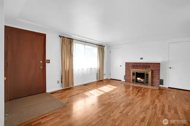 Large picture window pours natural light into the room.