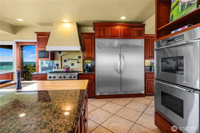 Step from the kitchen to an outdoor space equipped with a gas hookup for grilling, all while taking in beautiful, panoramic views.