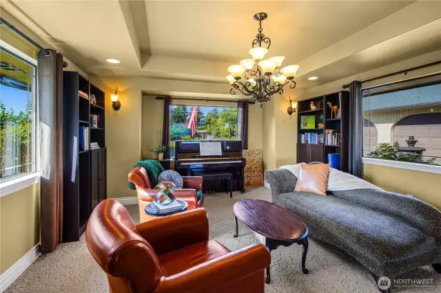 Formal dining room currently styled as a cozy upstairs living space—perfect for reading, relaxing, or creating your ideal retreat.
