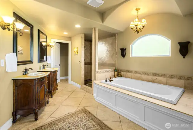 Relax and unwind in this stunning spa-style bathroom with heated floors—your private retreat at home.