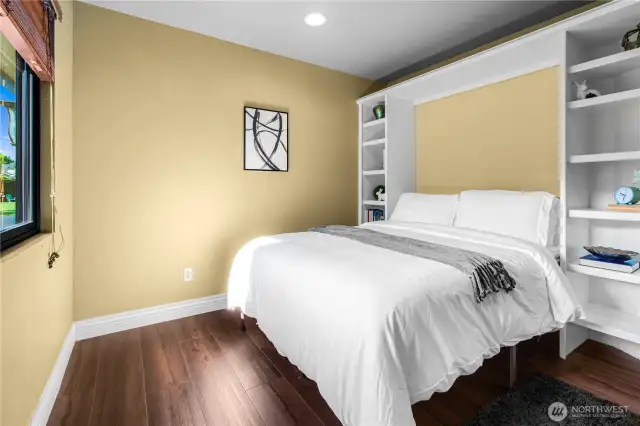 Second upstairs bedroom with built ins.