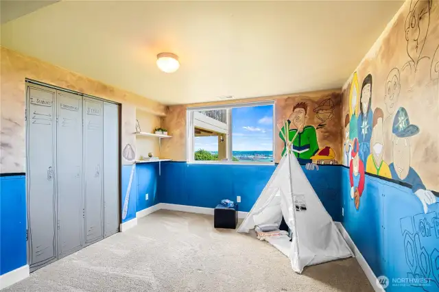 Showcasing an amazing sports mural, Bedroom #4 offers a lively and inspiring space for kids or sports enthusiasts.