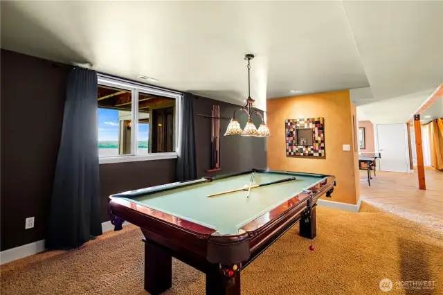 Enjoy endless fun in the dedicated game room complete with a pool table, ideal for family gatherings and socializing.