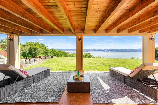 Lower level game room opens to a covered patio—an ideal spot to relax and take in the breathtaking views.
