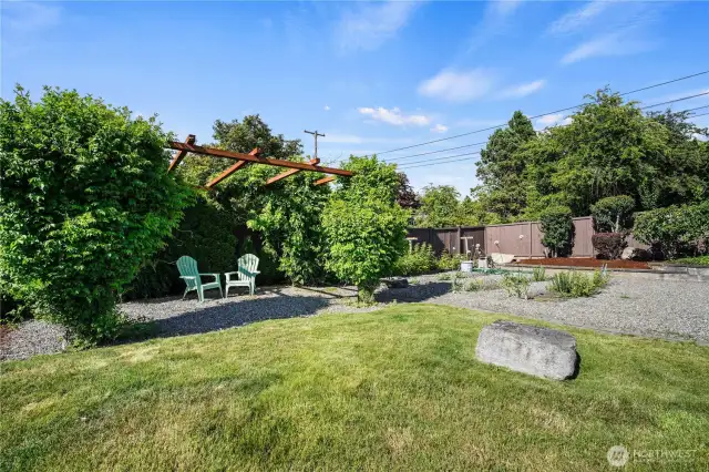 Charming garden area, ideal for those who love to cultivate flowers, veggies, and herbs—your personal green oasis.