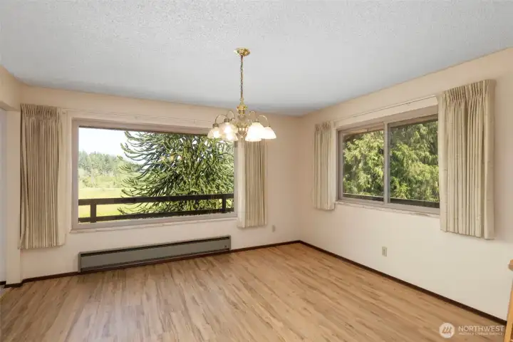 Room for the largest of dinning tables and accent furniture. Windows flood the room with light and allow enjoyment of the views.