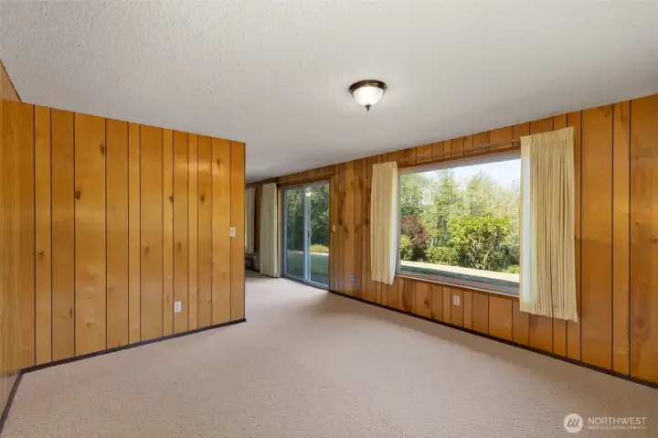 The lower level has a cozy feel but still large windows to bring in the views and light.
