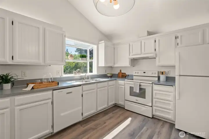 Large kitchen with plenty of storage space.