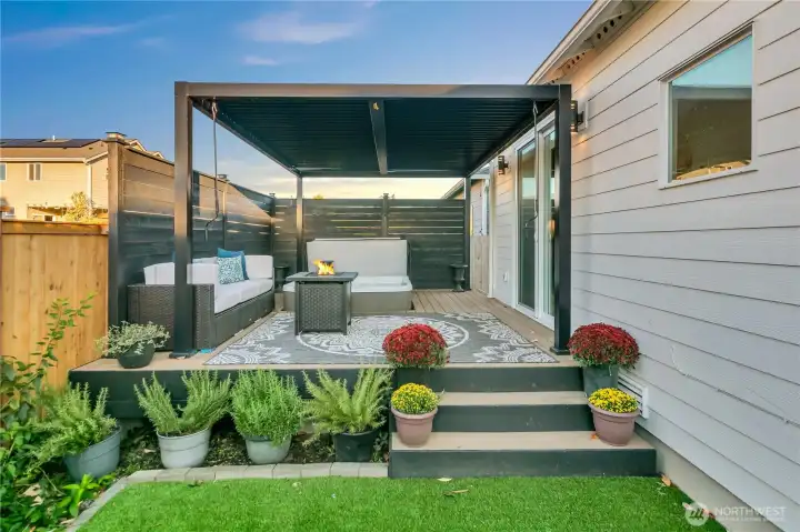 Covered, long lasting Trex deck with hot tub for year round relaxation