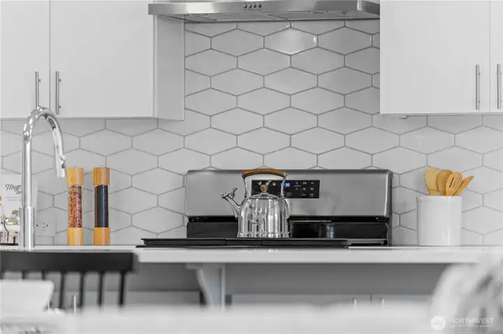 Full height tile backsplash in kitchen.
