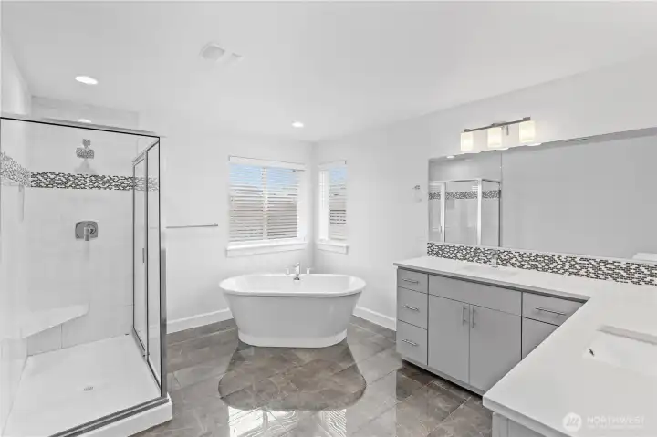 5 PC en-suite with standing tub and walk in shower with tile walls.