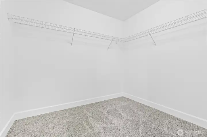 Primary Suite includes dual walk in closets.