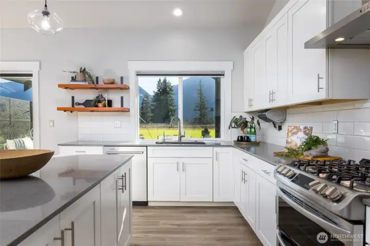 The wide kitchen prep area allows for good flow.  Stainless propane gas range/double oven, dishwasher, and refrigerator are all included.
