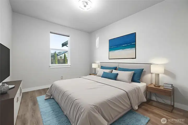 Main floor guest bedroom, virtually staged.