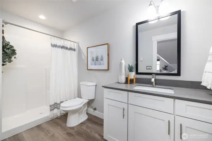 Guest bathroom upstairs with walk-in shower.