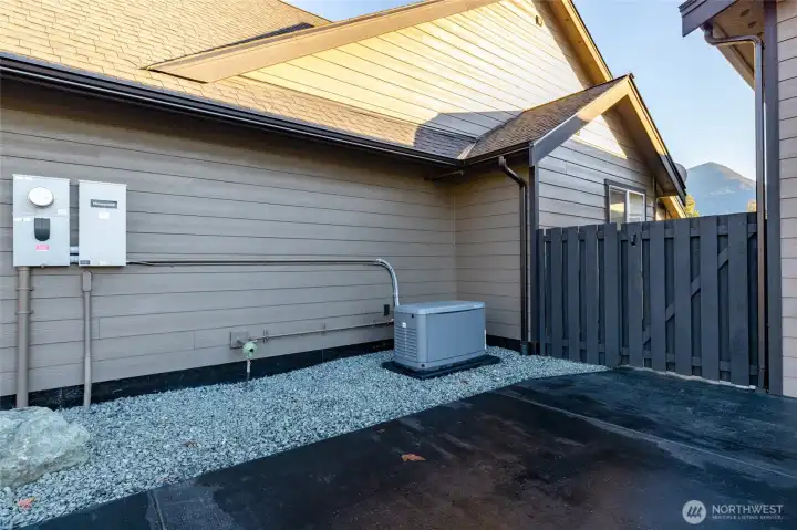 Whole-house hard-wired generator conveys with property.