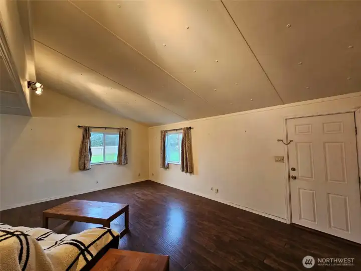 Front door to bright spacious living room.