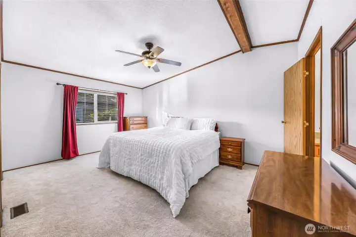 Primary bedroom with its own ensuite bathroom to the right
