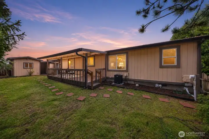 Spacious deck, private setting, and a powered workshop shed Spacious deck, private setting, and a powered workshop shed