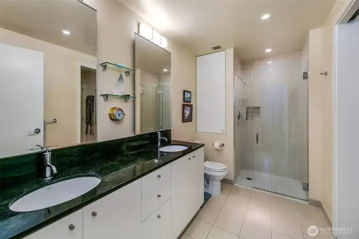 primary bath private and out looks in to the city sky line