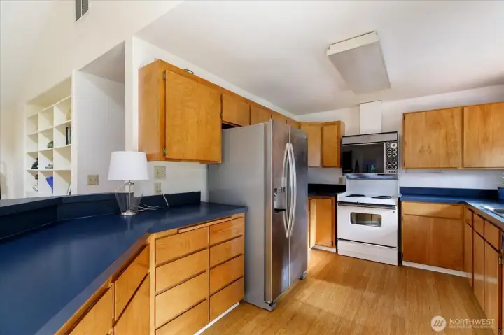 The kitchen's footprint allows for ease of cooking and prepping with ample storage.