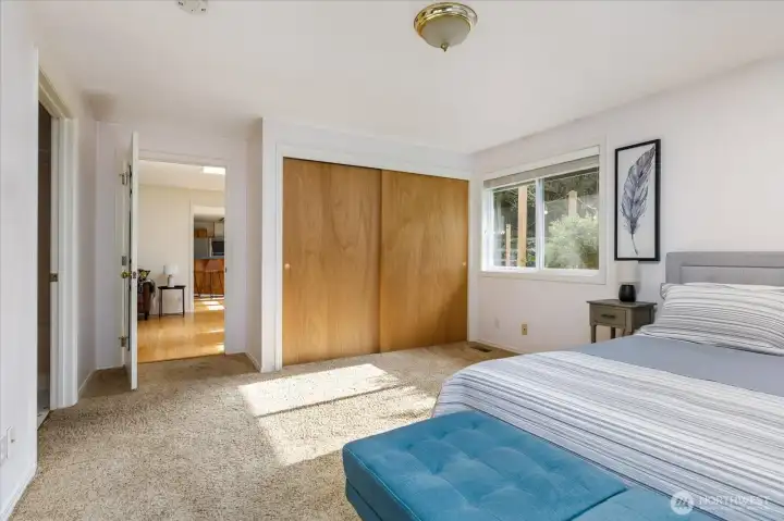 Open those closet doors to find an organized space for your clothes & a safe, too!