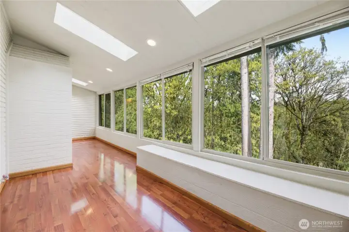 Enclosed and Climate Controlled Sun Deck overlooking Chambers Creek.