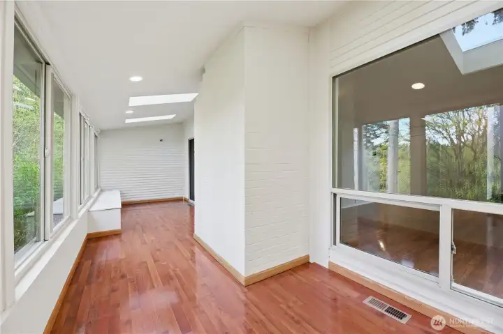 Enclosed and Climate Controlled Sun Deck overlooking Chambers Creek.