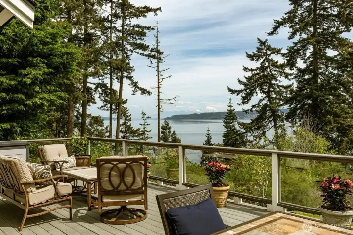 Privacy and endless views of the ocean, island, and mountains define this unique property.