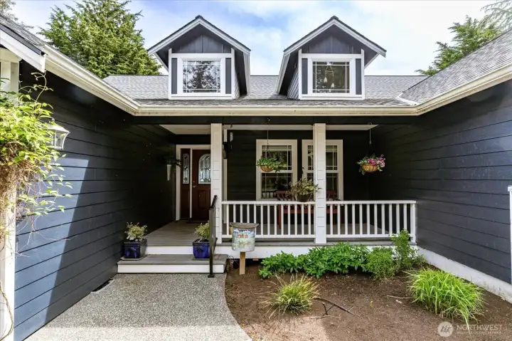 A covered front porch provides comfort and ease as you enter the home.