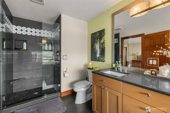 Tile shower double sinks.